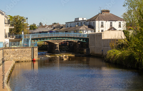 The slow flowing River Kesh flowing under the arched bridge in Kesh village in County fermanagh, Northern Ireland on a fine early spring morning.