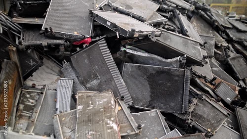 
Recycling of old cars. Automotive scrap. Recycling. Ecology and the environment. Scrap metal from old, destroyed cars. Metal recycling.