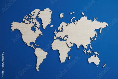 A gray map of the world is displayed on a blue background.
