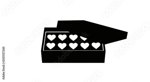 Fotografie Black matchbox with white hearts spilling out symbolizing love and affection in