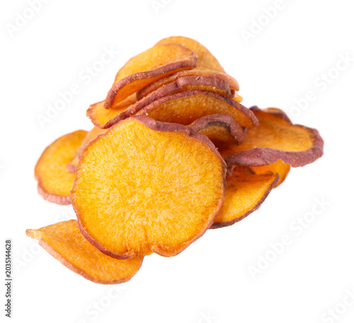 Crispy roasted sweet potato chips with sea salt, isolated on white background. Healthy and crunchy natural vegetable snack. Clipping path.
