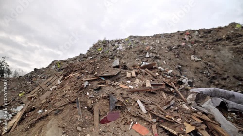 Landfill. Wood processing. Recycling. Ecology. Large mountains of bulk wood biomass. Wood recycling and processing.