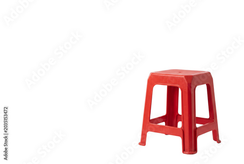 Photos Simple red plastic stool with empty copy space