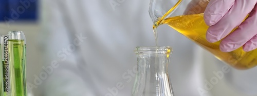 Photos Experiment involving liquid transfer in a laboratory setting with colorful reage