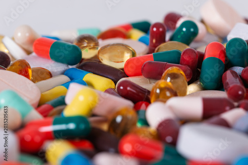substance abuse and overmedication  Large pile of mixed prescription pills  capsules  and tablets