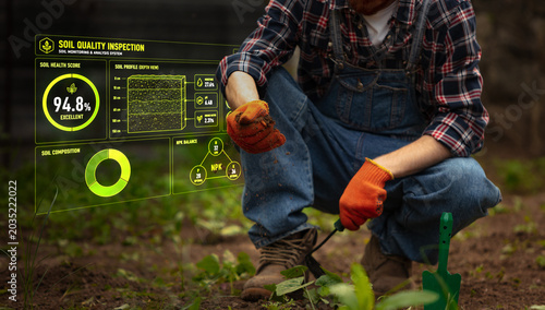 Bild auf Leinwand Smart soil quality inspection with farmer holding sample in garden