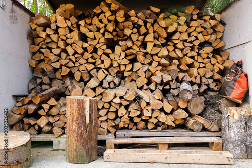 Quadro su tela Large pile of chopped firewood stacked in storage shed