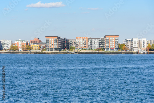 Modern apartment buildings in a new waterfront development on a sunny autumn day