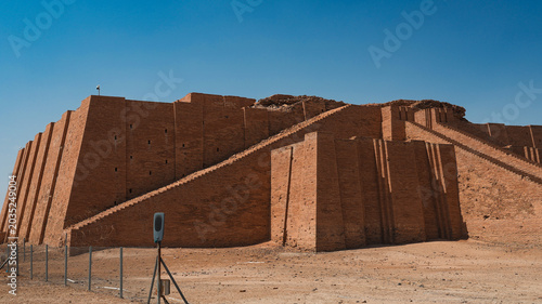 Exploring the ancient ziggurat of Ur in Iraq surrounded by clear blue skies