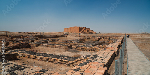 Exploration of the ancient Ziggurat of Ur in modern day Iraq during bright daylight