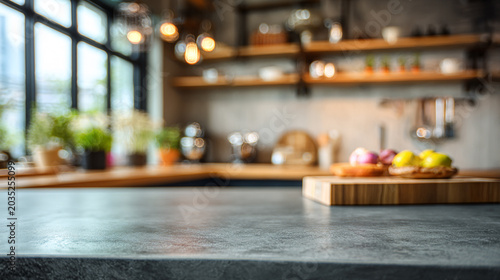 Empty concrete countertop foreground with cutting board and blurred industrial kitchen background