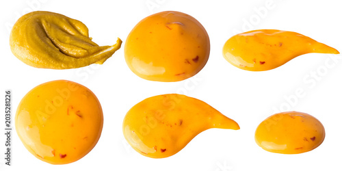 Fotografie Various shapes and sizes of yellow mustard and sauce blobs isolated on a transpa