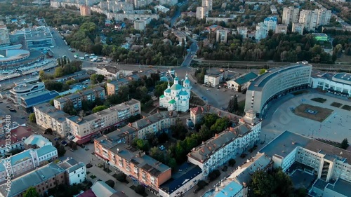 Drone view of the Resurrection Cathedral in the center of Sumy, Ukraine. Historical Orthodox monument against the backdrop of the cityscape. Urban architecture of the city of Sumy from a drone