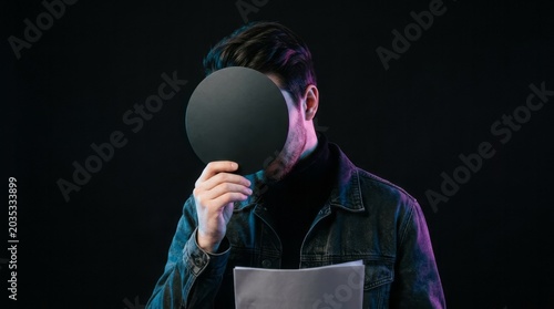 Mysterious Man Hiding Face with Circle
