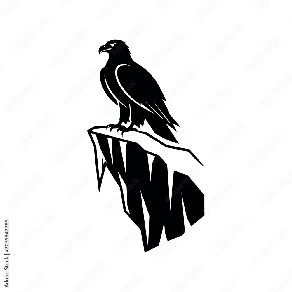 Fototapeta premium Silhouette of an eagle perched on a rocky cliff.