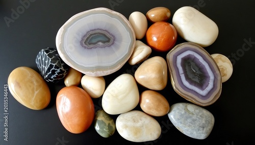 Collection of Polished Agate Slices and Smooth River Stones.