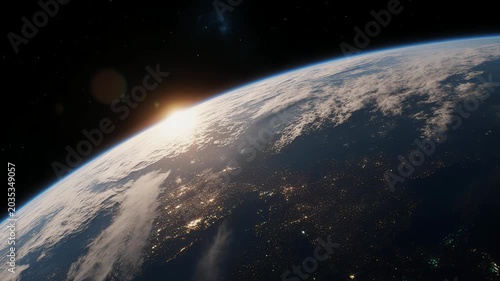 Sunrise over the curve of earth rotation seen from orbit