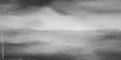 Photos A dramatic landscape of dark stormy clouds rolling over a misty mountain forest