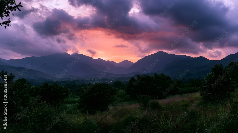 Obraz premium A dramatic and colorful sky with vibrant clouds over a vast landscape during sunset or sunrise