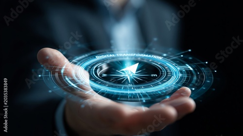 A businessman holding a digital transformation compass in his hand with a dark background