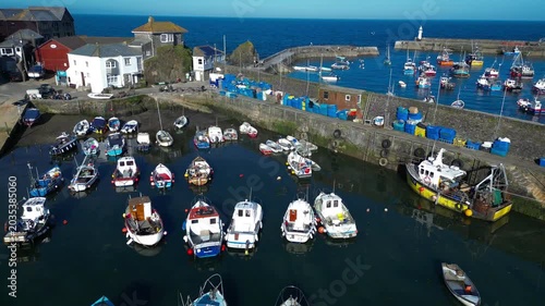 Aerial views of the harbor in the costal village and port of Mevagissey on the south coast of Cornwall in the southwest of England.