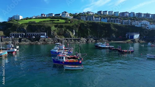 Aerial views of the harbor in the costal village and port of Mevagissey on the south coast of Cornwall in the southwest of England.