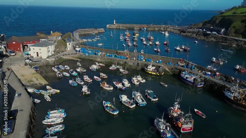 Aerial views of the harbor in the costal village and port of Mevagissey on the south coast of Cornwall in the southwest of England.