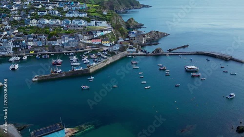 Aerial views of the harbor in the costal village and port of Mevagissey on the south coast of Cornwall in the southwest of England.