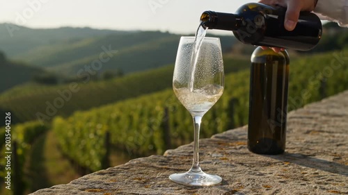 Pouring White Wine into Glass in Tuscan Vineyard 4K Video