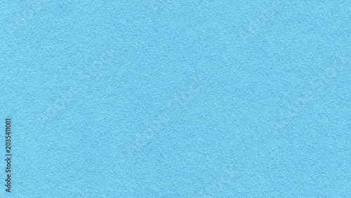 Light blue textured paper background with subtle grain surface and soft structure. Pastel turquoise backdrop, macro