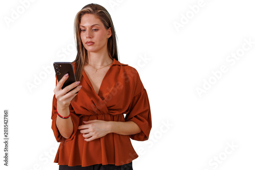 Fotografie Young woman engrossed in smartphone browsing, using mobile technology for commun