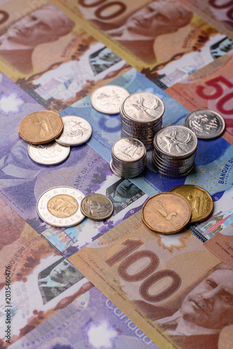 Money, currency of Canada, dollar banknotes of various denominations. Canadian money