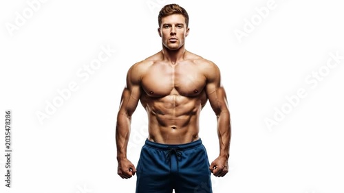 Physically fit man posing confidently in athletic shorts