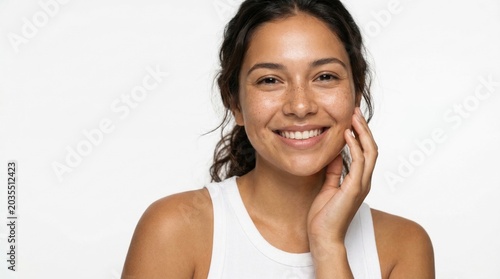 Portrait of a young dark-skinned smiling woman with freckles on her face, photo