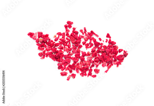 dried raspberry pieces on a white background