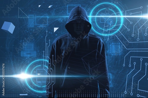 Obraz na płótnie Silhouette of a man hacker in the hood
