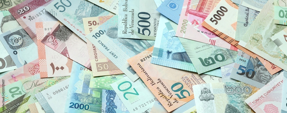 Fototapeta premium Big amount of money bills of various currencies. Assortment background of international cash