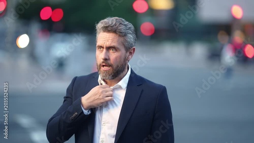 Headache business man suffering from overwork. Headache business man dealing with job stress. Headache business man facing loneliness in the city. Headache business man exhausted.
