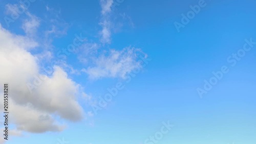 The greyish clouds are moving in the sky
