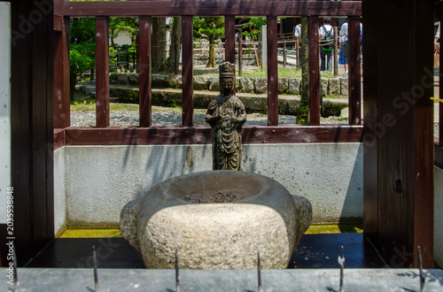 Ancient Stone Buddha Statue at Temple in Kyoto