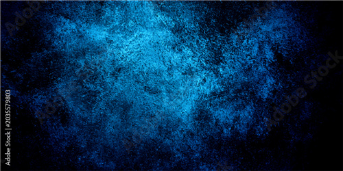 Cuadro en lienzo Ethereal blue particle cloud swirls against deep black background, suggesting cosmic dust or abstract energy form