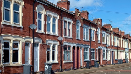 Tableau sur toile Traditional British terraced houses, red brick Victorian residential street, cla