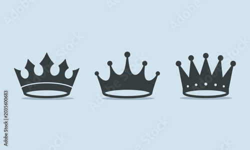 Three black crown icons on a light blue background, representing royalty and power