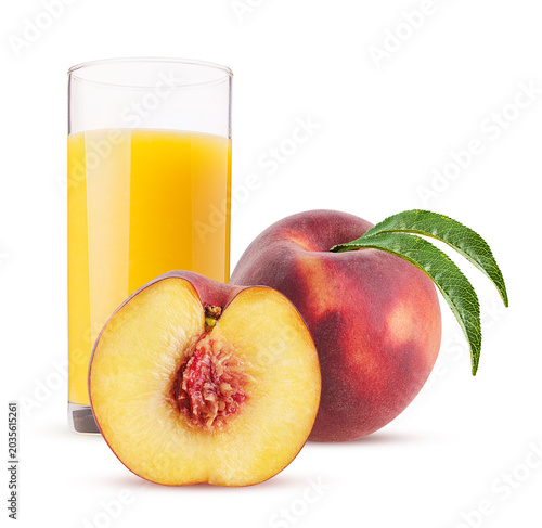 Glass of juice Peach fruit one cut in half with green leaf