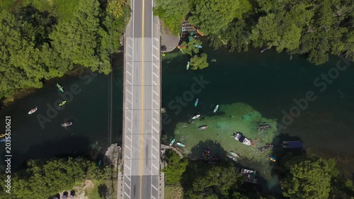 Aerial View of Tropical River Bridge with Kayakers on clear water