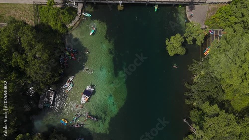 Aerial View of Tropical River Bridge with Kayakers on clear water