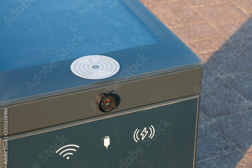 Modern public seats are equipped with built-in photovoltaic systems for generating electricity, allowing charging of various devices.