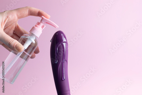 Slika na platnu Sex toy with intimate lubricant on a colored background