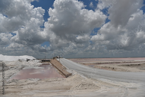 Expansive salt flat landscape under stormy clouds