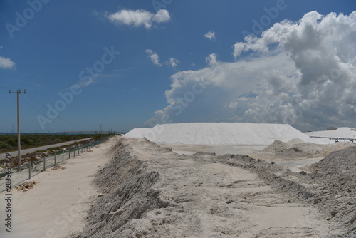 Expansive salt flat landscape under stormy clouds